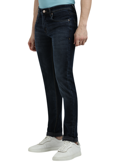 Model wearing Clarke Gable's Navy Blue Faded Skinny Fit Jeans in a casual setting