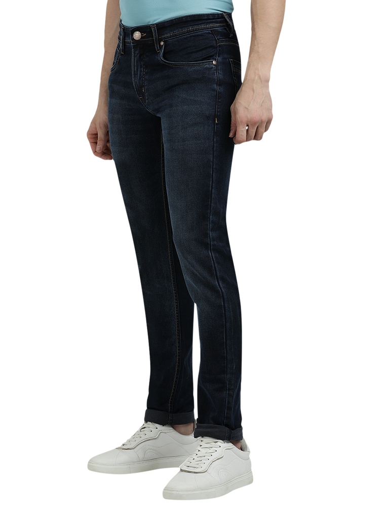 Model wearing Clarke Gable's Navy Blue Faded Skinny Fit Jeans in a casual setting