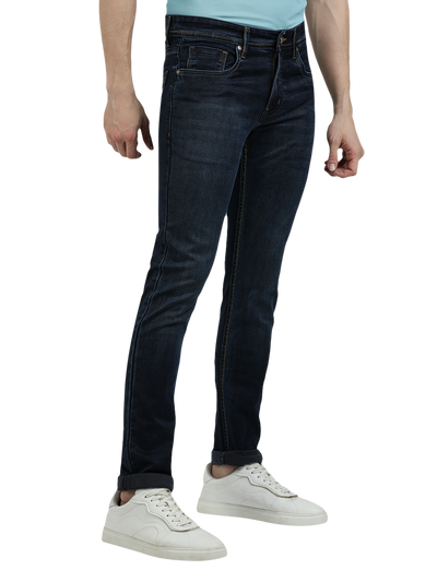 Model wearing Clarke Gable's Navy Blue Faded Skinny Fit Jeans in a casual setting