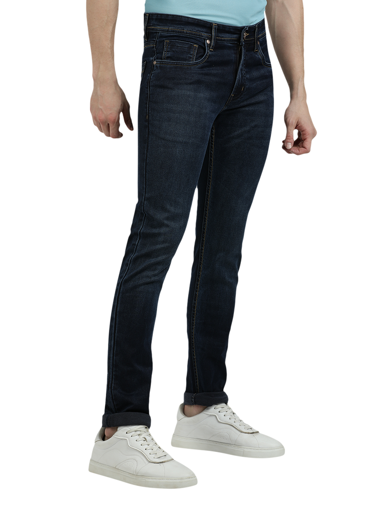 Model wearing Clarke Gable's Navy Blue Faded Skinny Fit Jeans in a casual setting