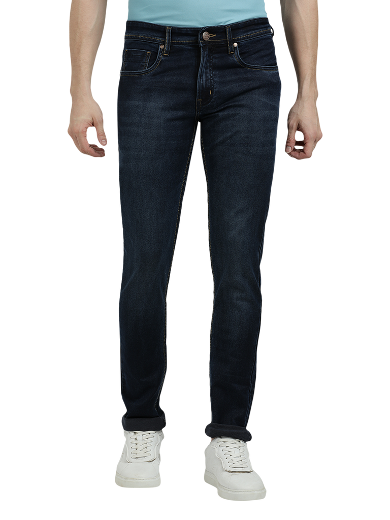 Model wearing Clarke Gable's Navy Blue Faded Skinny Fit Jeans in a casual setting