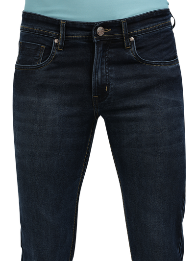 Model wearing Clarke Gable's Navy Blue Faded Skinny Fit Jeans in a casual setting