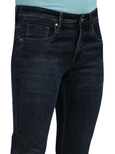 Model wearing Clarke Gable's Navy Blue Faded Skinny Fit Jeans in a casual setting