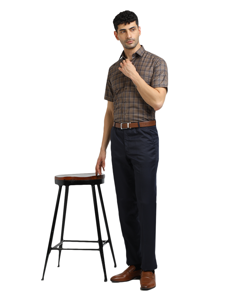 Model wearing Clarke Gable's Navy Blue Casual Fit Trousers in a casual setting