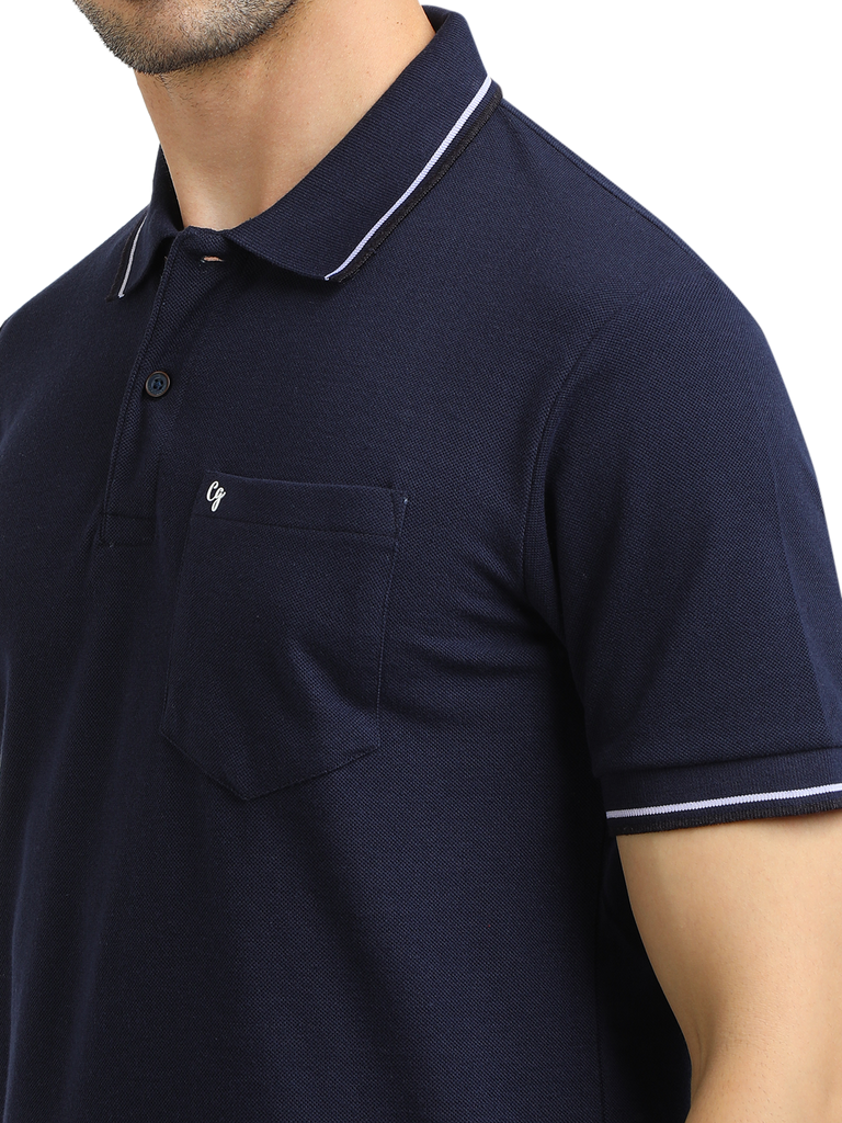 Model wearing Clarke Gable's Navy Blue Solid Polo Collar T-Shirt in a casual setting