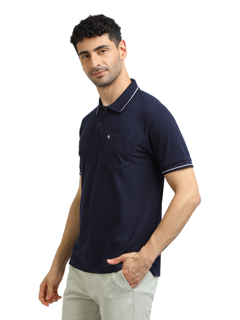 Model wearing Clarke Gable's Navy Blue Solid Polo Collar T-Shirt in a casual setting