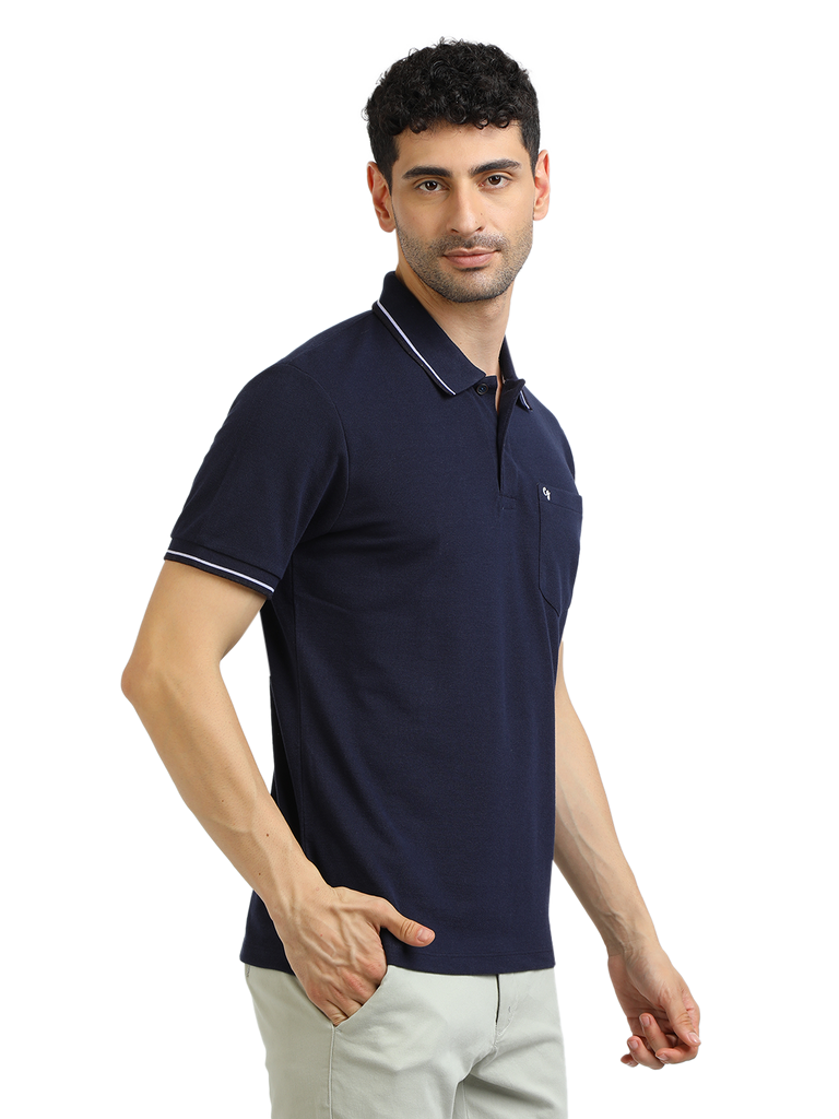 Model wearing Clarke Gable's Navy Blue Solid Polo Collar T-Shirt in a casual setting