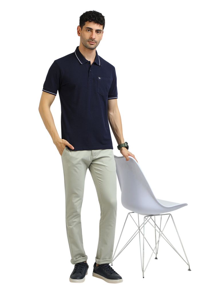 Model wearing Clarke Gable's Navy Blue Solid Polo Collar T-Shirt in a casual setting