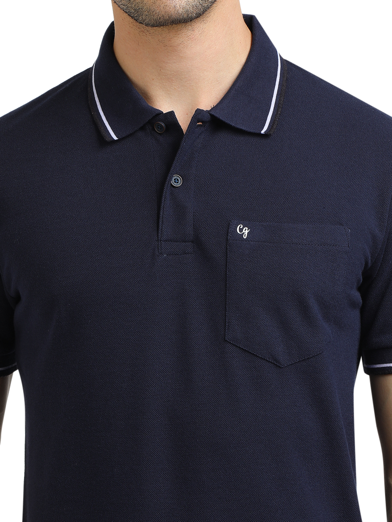 Model wearing Clarke Gable's Navy Blue Solid Polo Collar T-Shirt in a casual setting