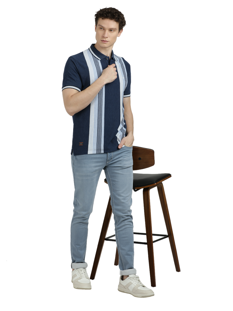 Model wearing Clarke Gable's Navy Blue with Light Blue Striped Polo Collar T-Shirt in a casual setting