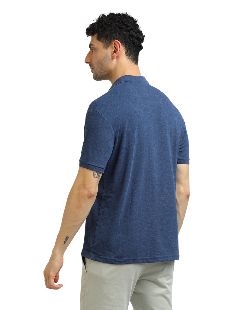 Model wearing Clarke Gable's Navy Melange Solid Polo Collar T-Shirt in a casual setting