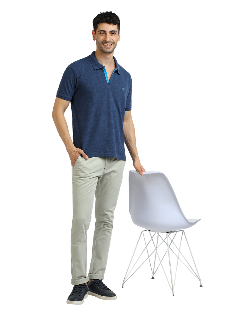 Model wearing Clarke Gable's Navy Melange Solid Polo Collar T-Shirt in a casual setting