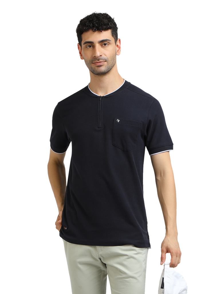 Model wearing Clarke Gable's Navy Solid Henley Neck T-Shirt in a casual setting