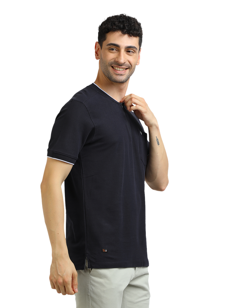 Model wearing Clarke Gable's Navy Solid Henley Neck T-Shirt in a casual setting