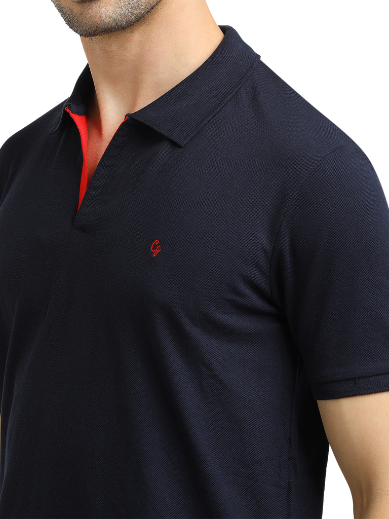 Model wearing Clarke Gable's Navy Solid Polo Collar T-Shirt in a casual setting