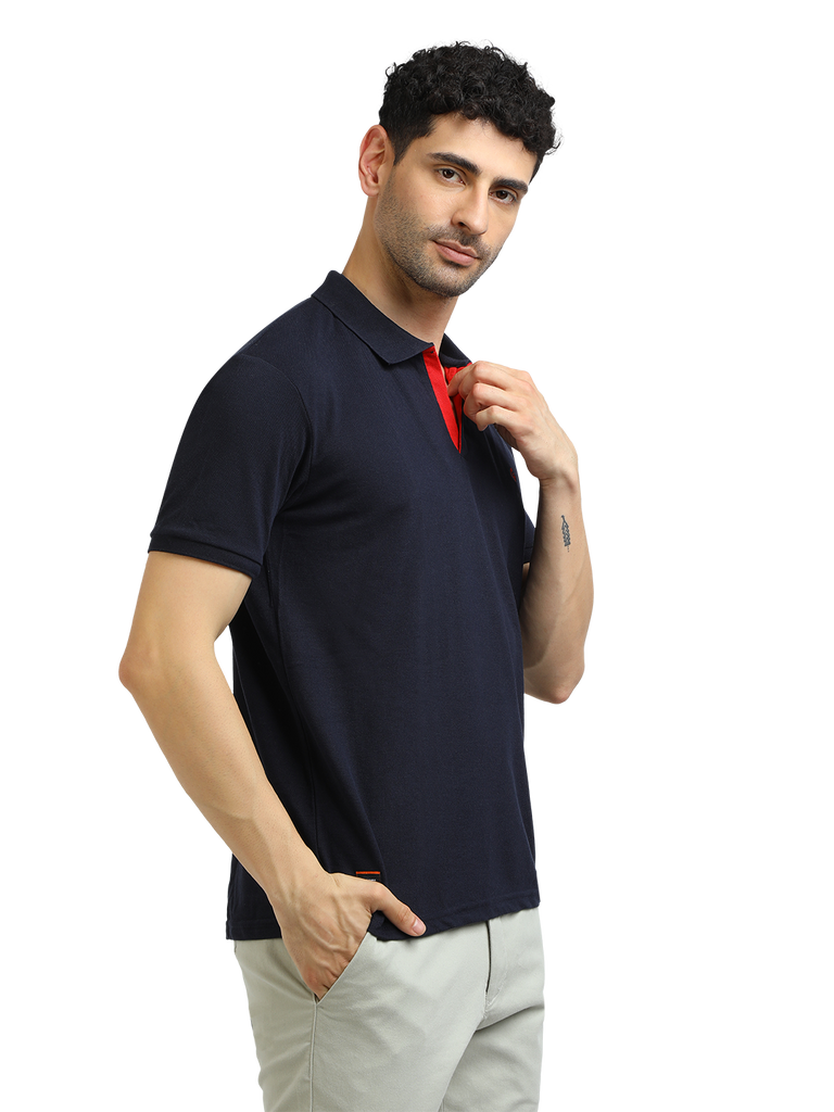 Model wearing Clarke Gable's Navy Solid Polo Collar T-Shirt in a casual setting