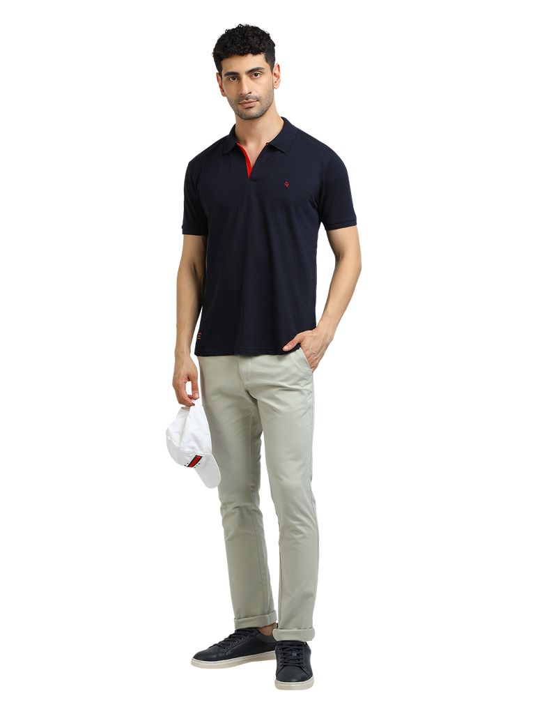 Model wearing Clarke Gable's Navy Solid Polo Collar T-Shirt in a casual setting