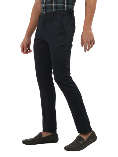 Model wearing Clarke Gable's Navy Trim Fit Trousers in a casual setting