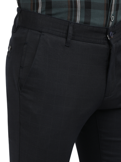 Model wearing Clarke Gable's Navy Trim Fit Trousers in a casual setting