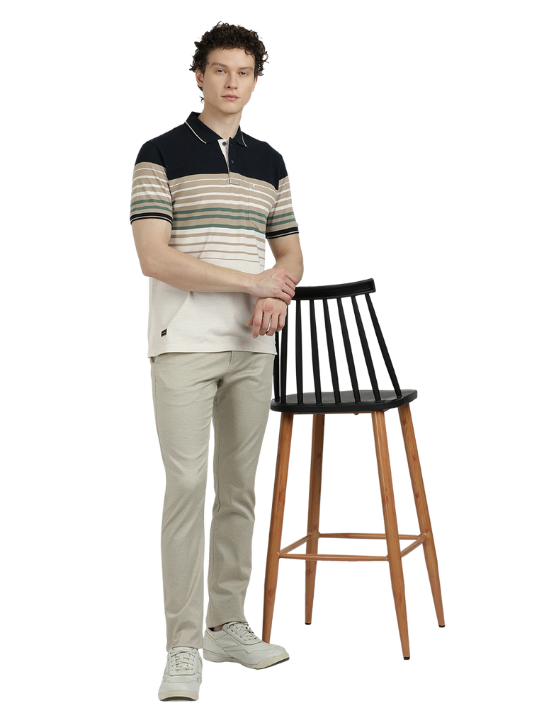 Model wearing Clarke Gable's Off White With Black Striped Polo Collar T-Shirt in a casual setting
