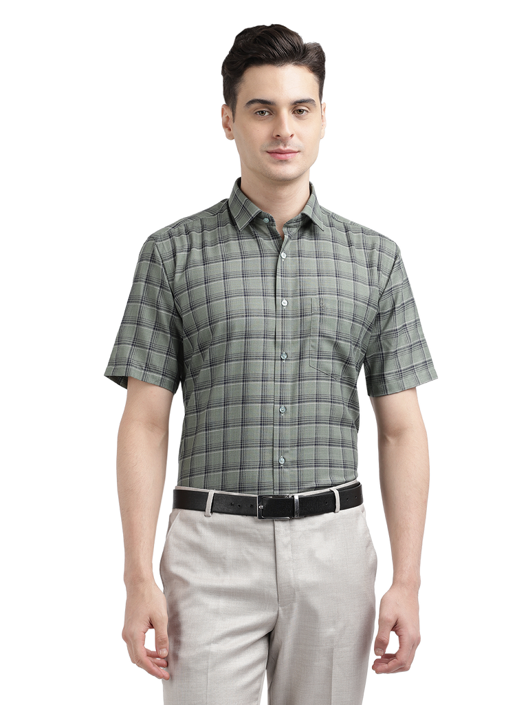 Model wearing Clarke Gable's Olive Green Checked Formal Shirt in a casual setting