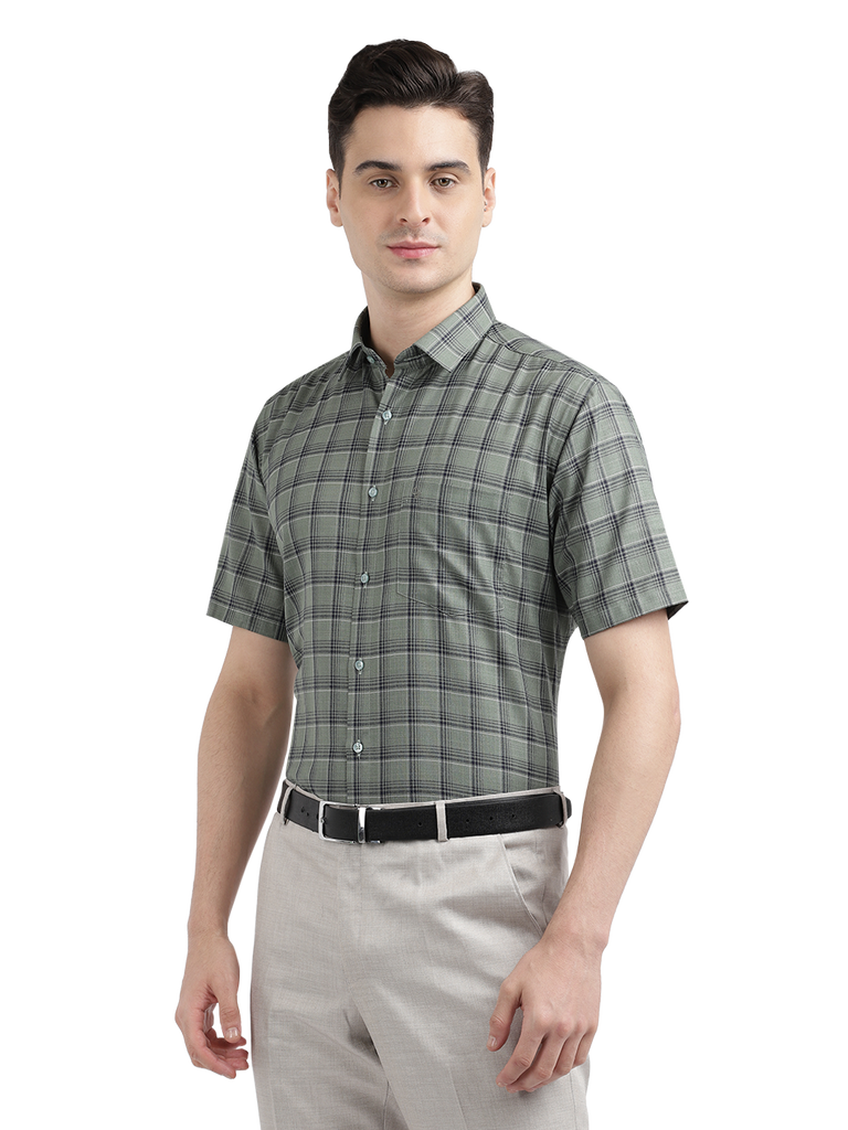 Model wearing Clarke Gable's Olive Green Checked Formal Shirt in a casual setting