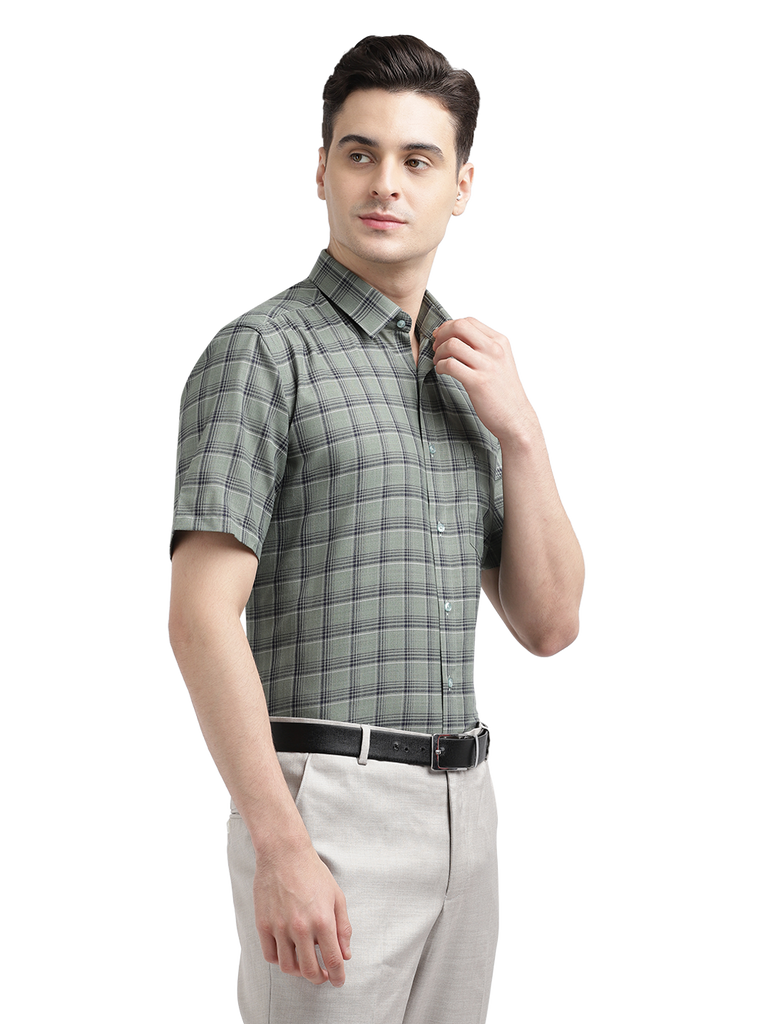 Model wearing Clarke Gable's Olive Green Checked Formal Shirt in a casual setting