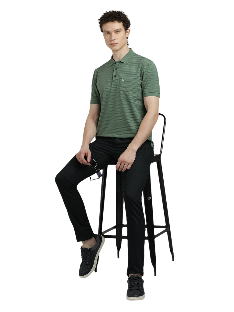 Model wearing Clarke Gable's Olive Green Printed Polo Collar T-Shirt in a casual setting