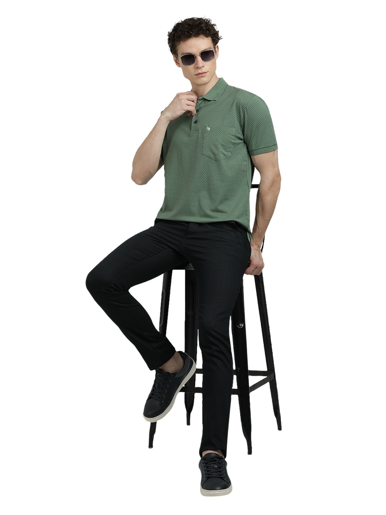 Model wearing Clarke Gable's Olive Green Printed Polo Collar T-Shirt in a casual setting