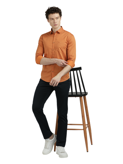 Model wearing Clarke Gable's Orange Printed Semi Casual Shirt in a casual setting