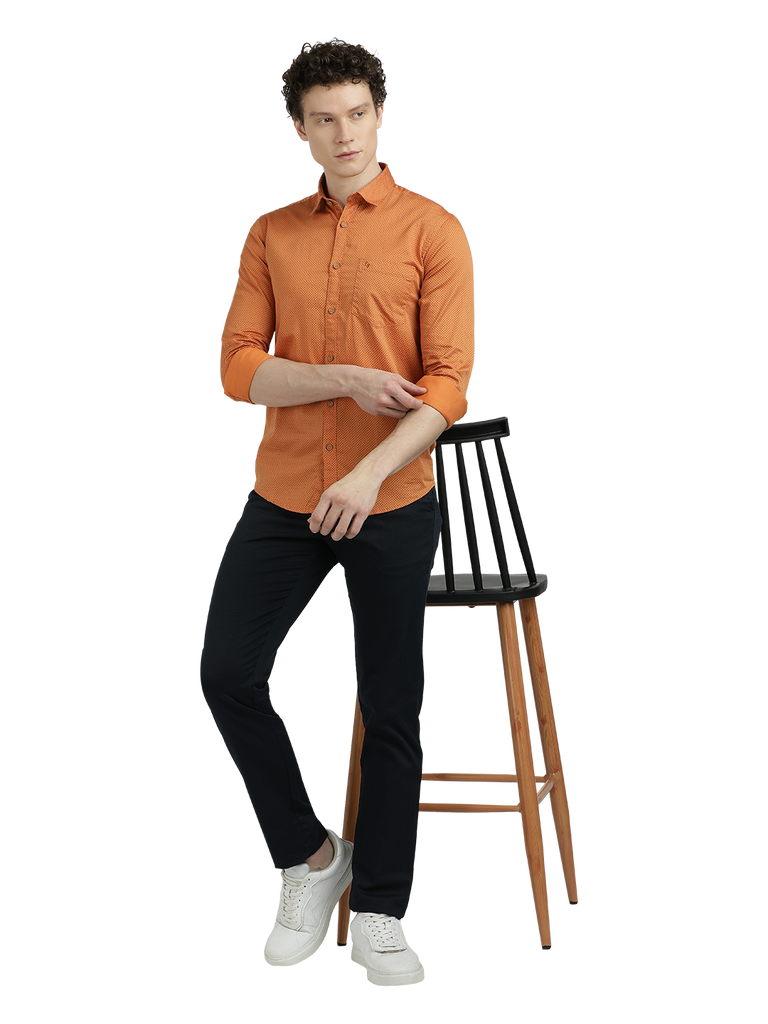 Model wearing Clarke Gable's Orange Printed Semi Casual Shirt in a casual setting