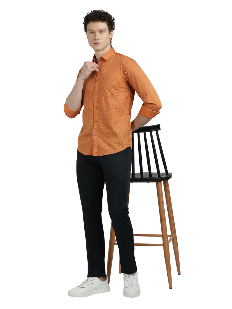 Model wearing Clarke Gable's Orange Printed Semi Casual Shirt in a casual setting