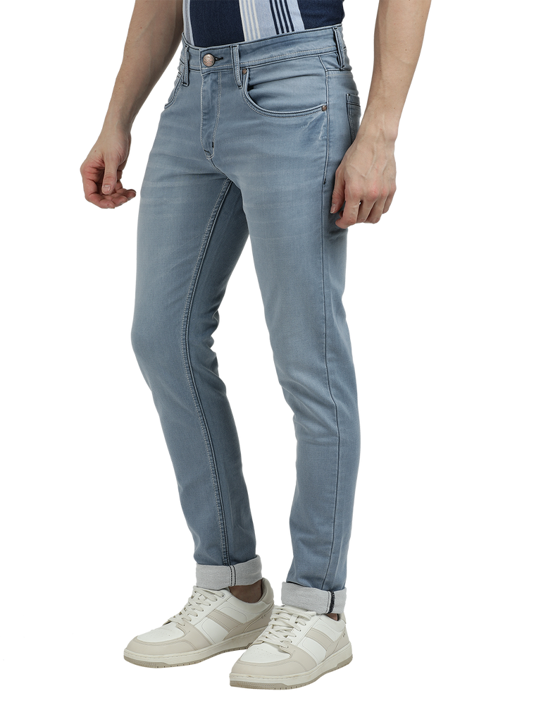 Model wearing Clarke Gable's Pastel Blue Skinny Fit Jeans in a casual setting