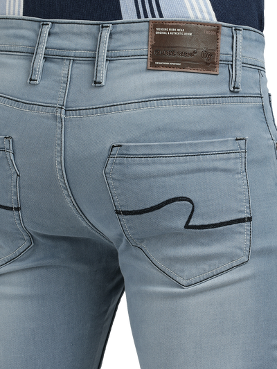 Model wearing Clarke Gable's Pastel Blue Skinny Fit Jeans in a casual setting