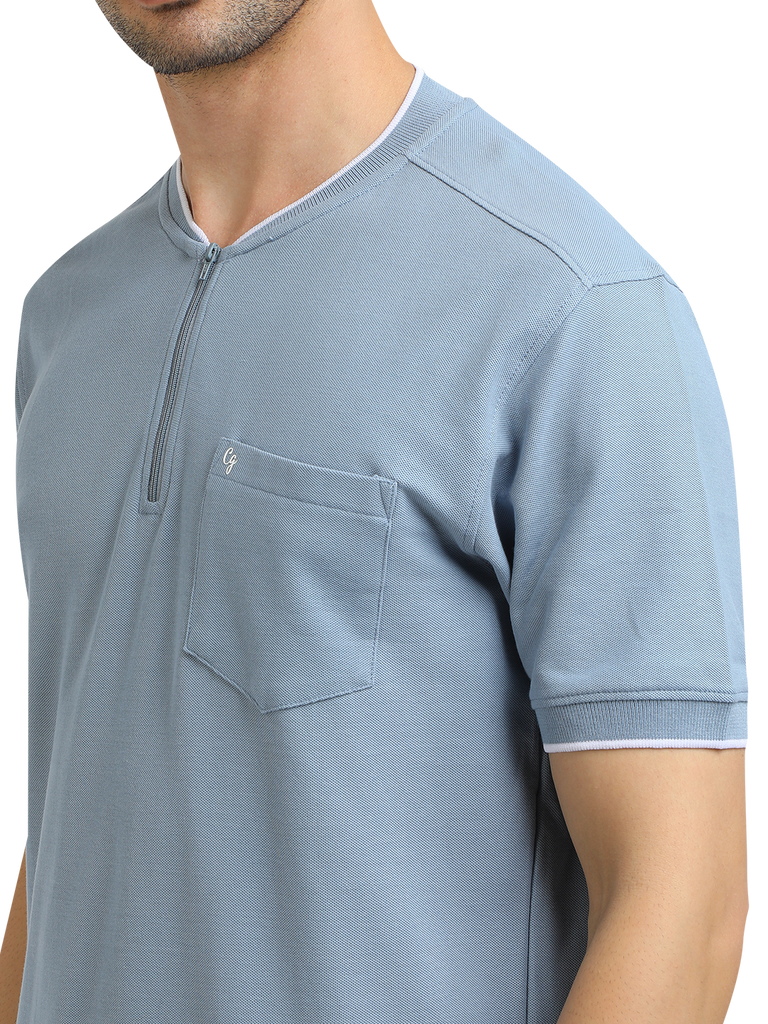 Model wearing Clarke Gable's Pale Blue Solid Henley Neck T-Shirt in a casual setting