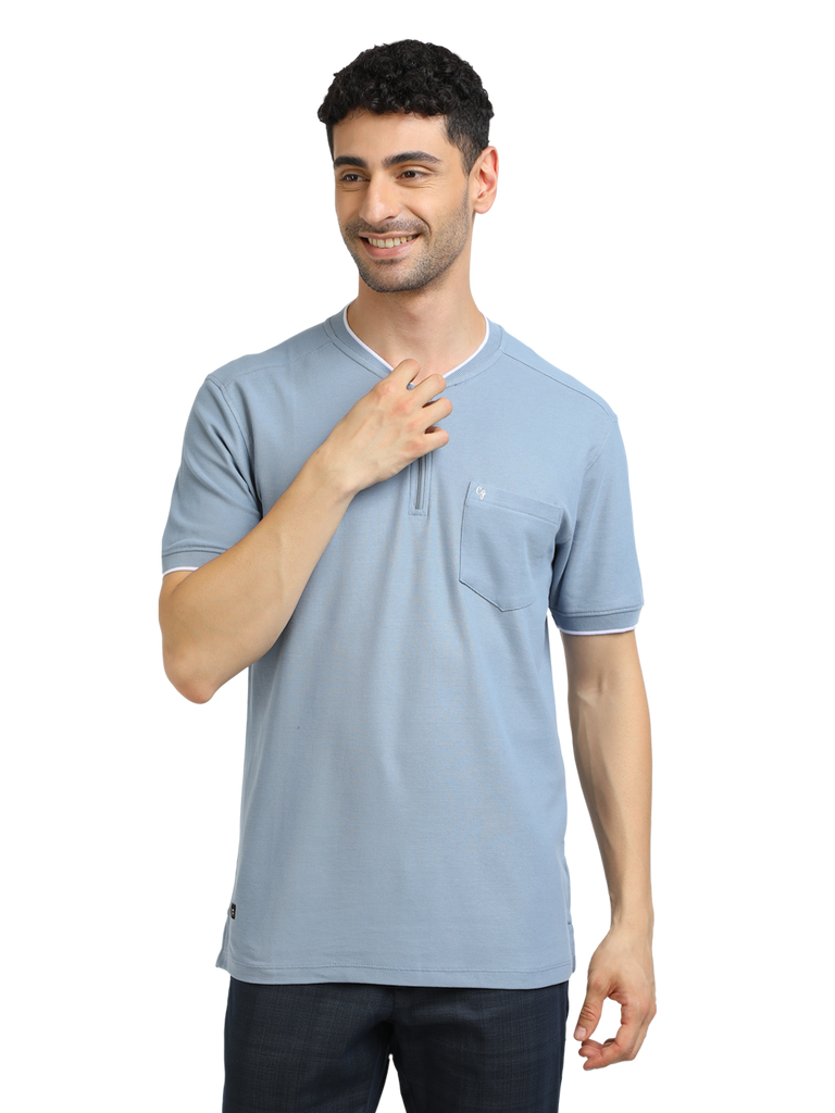 Model wearing Clarke Gable's Pale Blue Solid Henley Neck T-Shirt in a casual setting