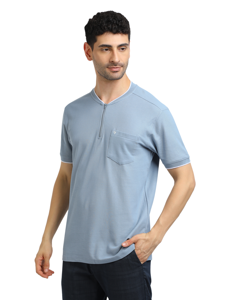 Model wearing Clarke Gable's Pale Blue Solid Henley Neck T-Shirt in a casual setting