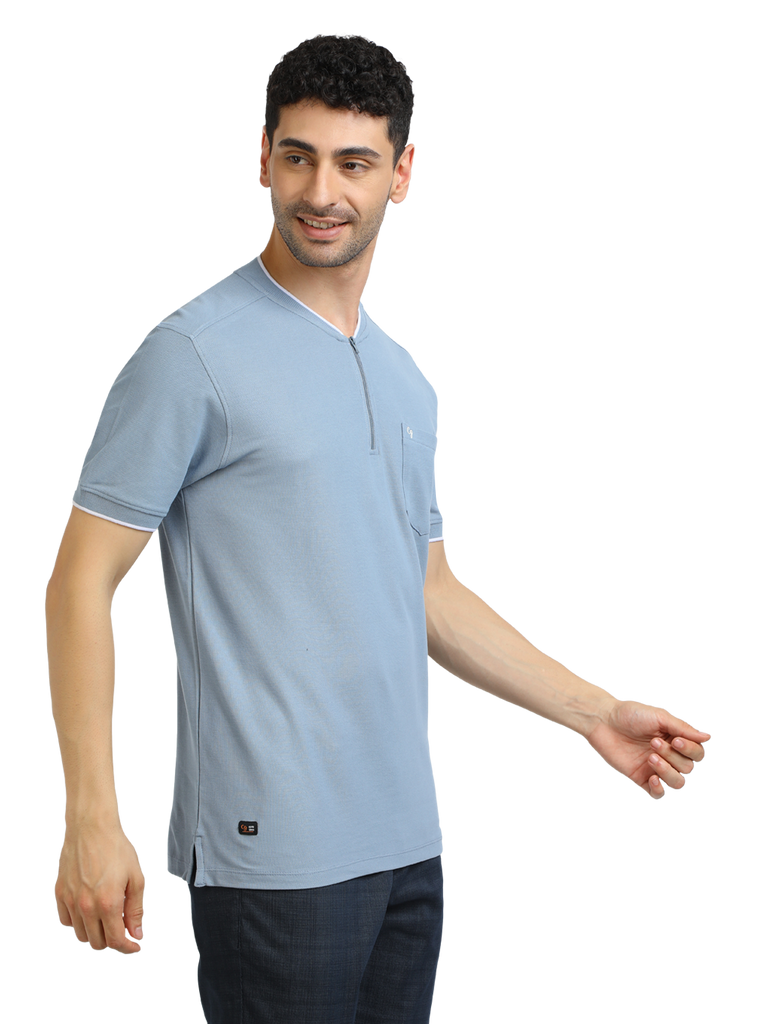 Model wearing Clarke Gable's Pale Blue Solid Henley Neck T-Shirt in a casual setting