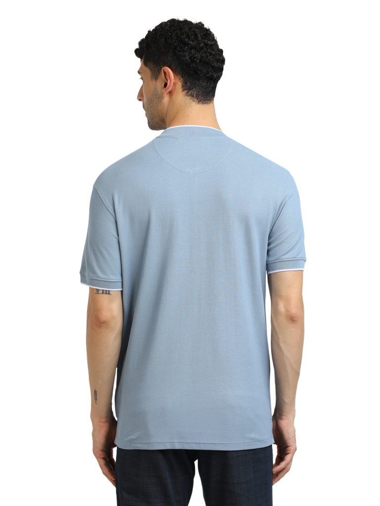 Model wearing Clarke Gable's Pale Blue Solid Henley Neck T-Shirt in a casual setting