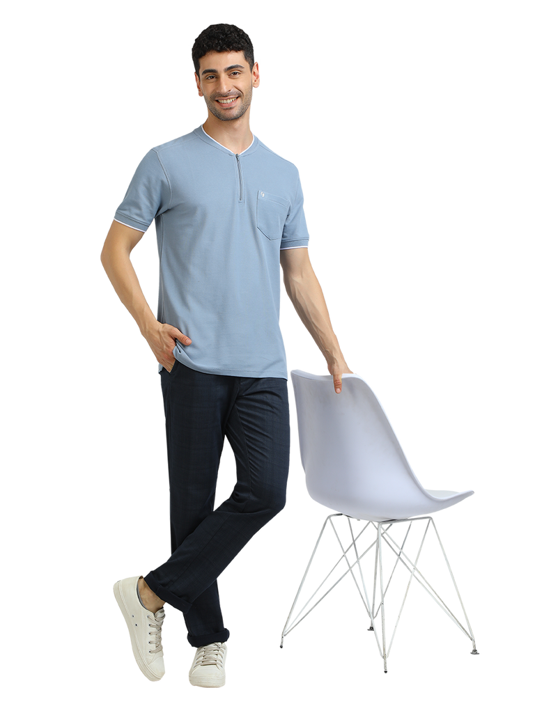 Model wearing Clarke Gable's Pale Blue Solid Henley Neck T-Shirt in a casual setting