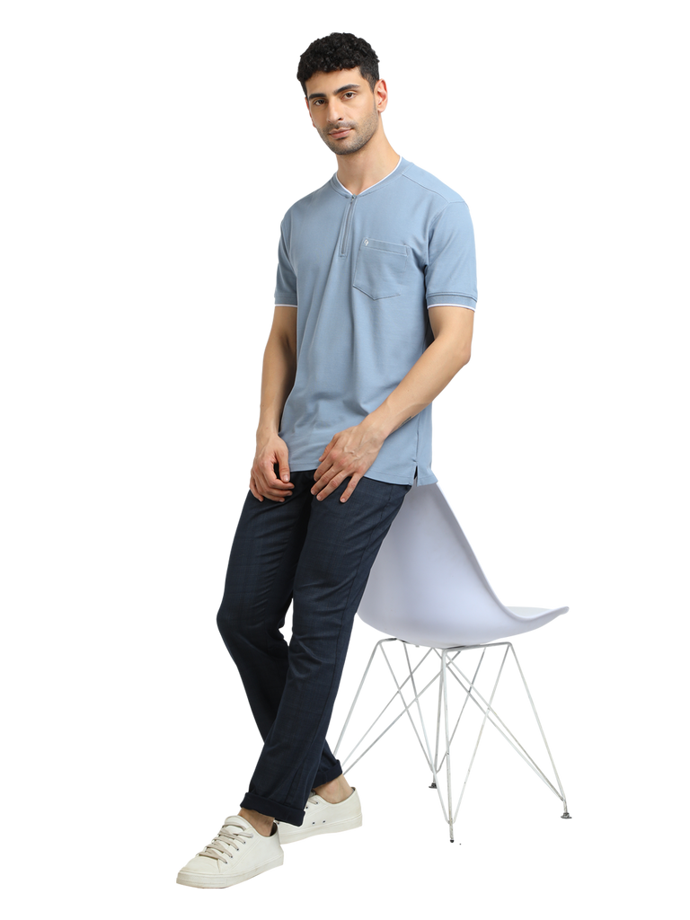 Model wearing Clarke Gable's Pale Blue Solid Henley Neck T-Shirt in a casual setting