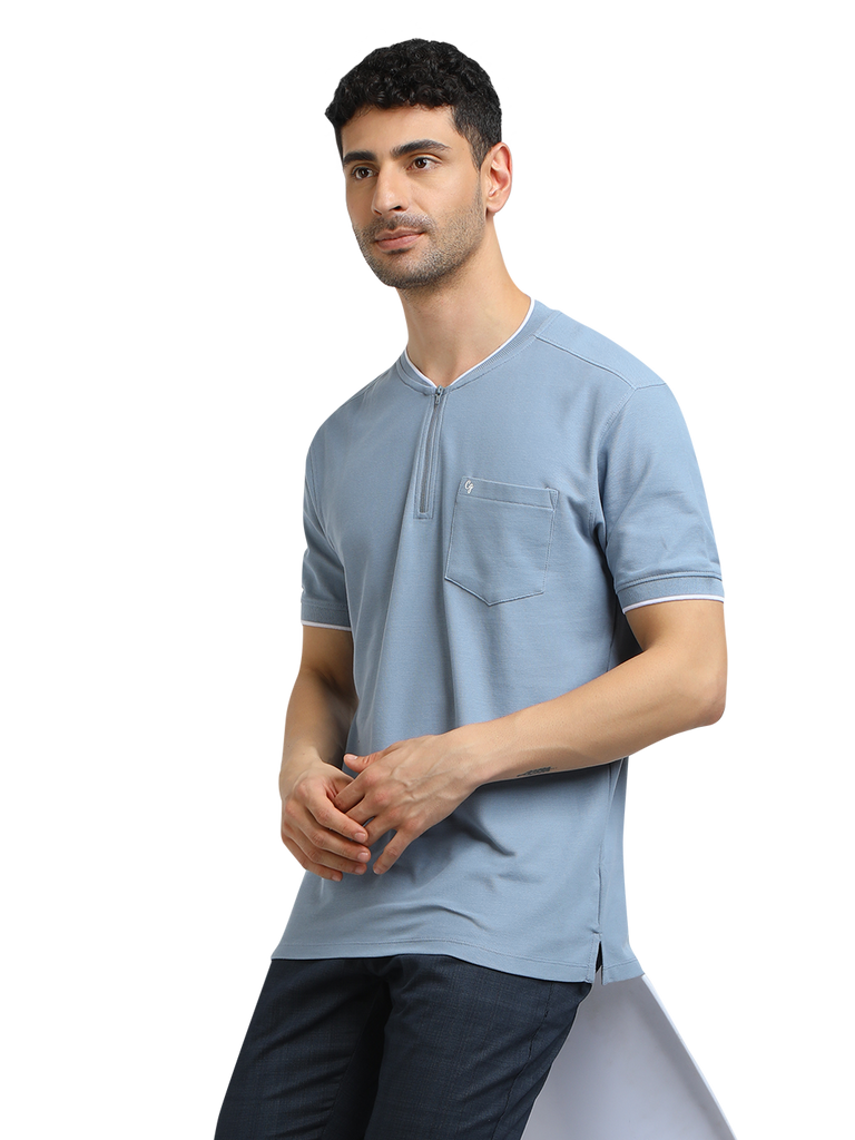 Model wearing Clarke Gable's Pale Blue Solid Henley Neck T-Shirt in a casual setting