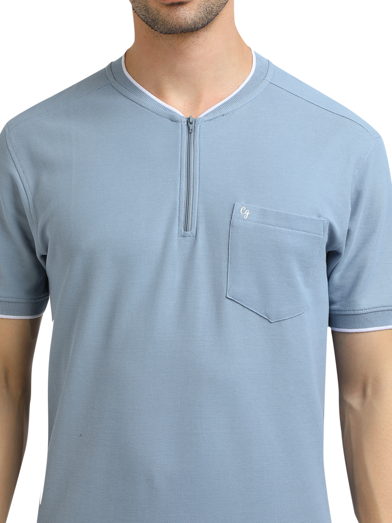 Model wearing Clarke Gable's Pale Blue Solid Henley Neck T-Shirt in a casual setting