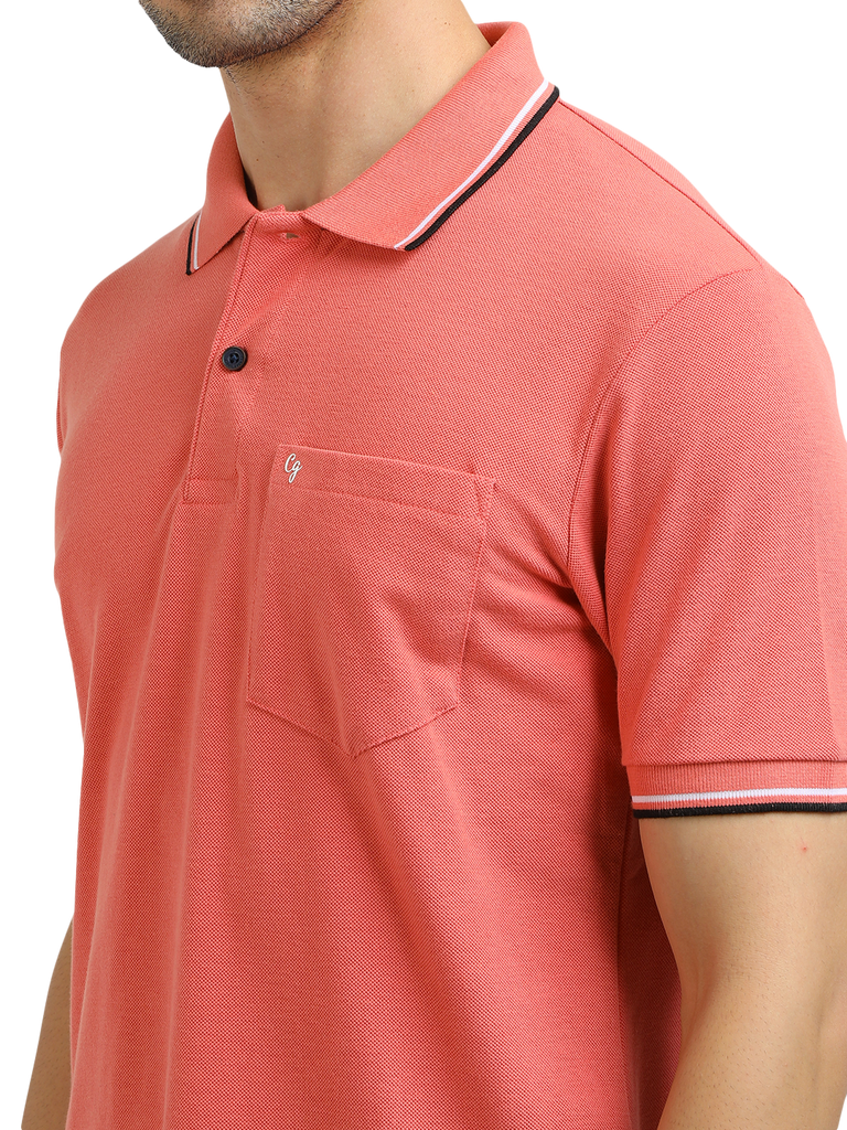 Model wearing Clarke Gable's Peach Solid Polo Collar T-Shirt in a casual setting