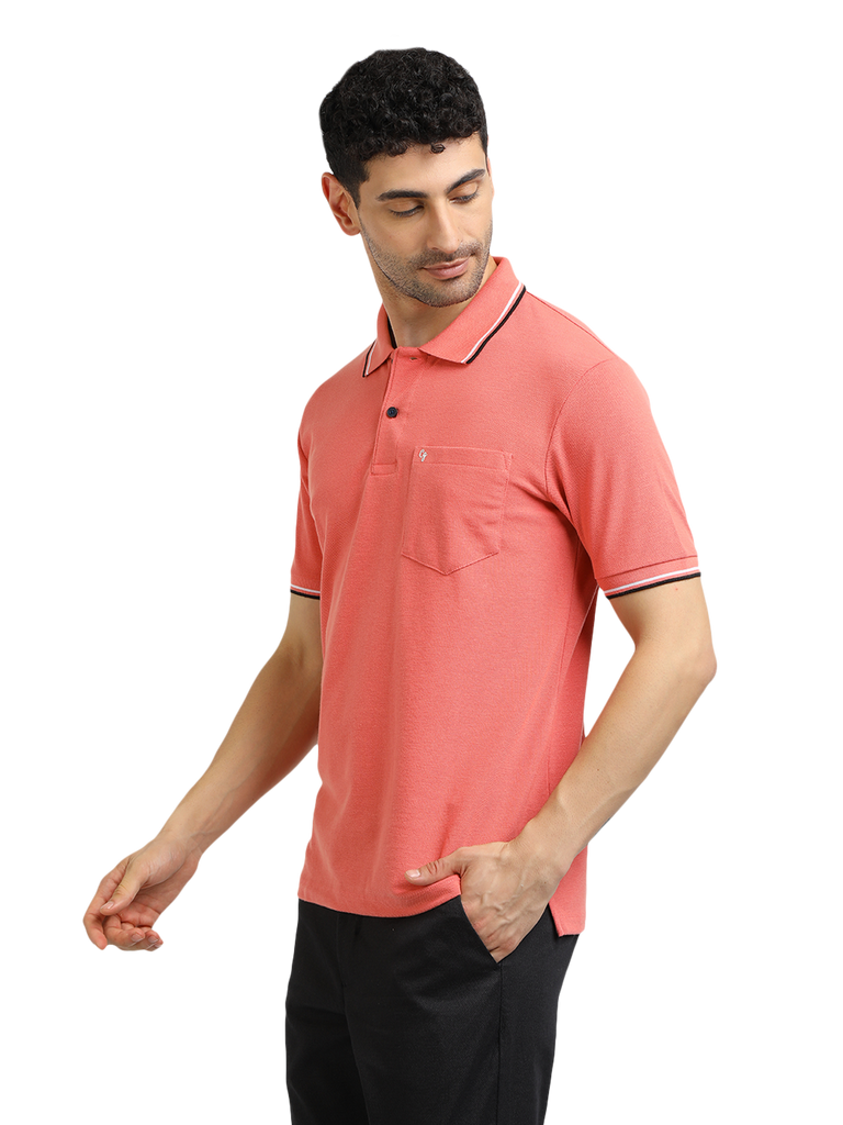 Model wearing Clarke Gable's Peach Solid Polo Collar T-Shirt in a casual setting