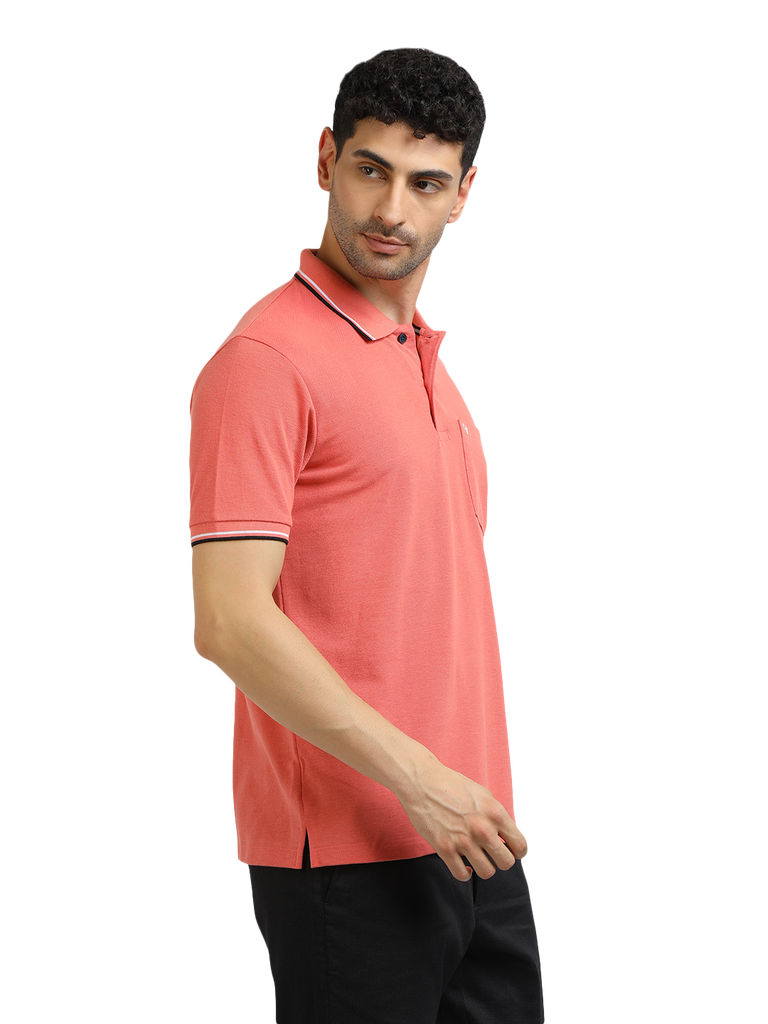 Model wearing Clarke Gable's Peach Solid Polo Collar T-Shirt in a casual setting