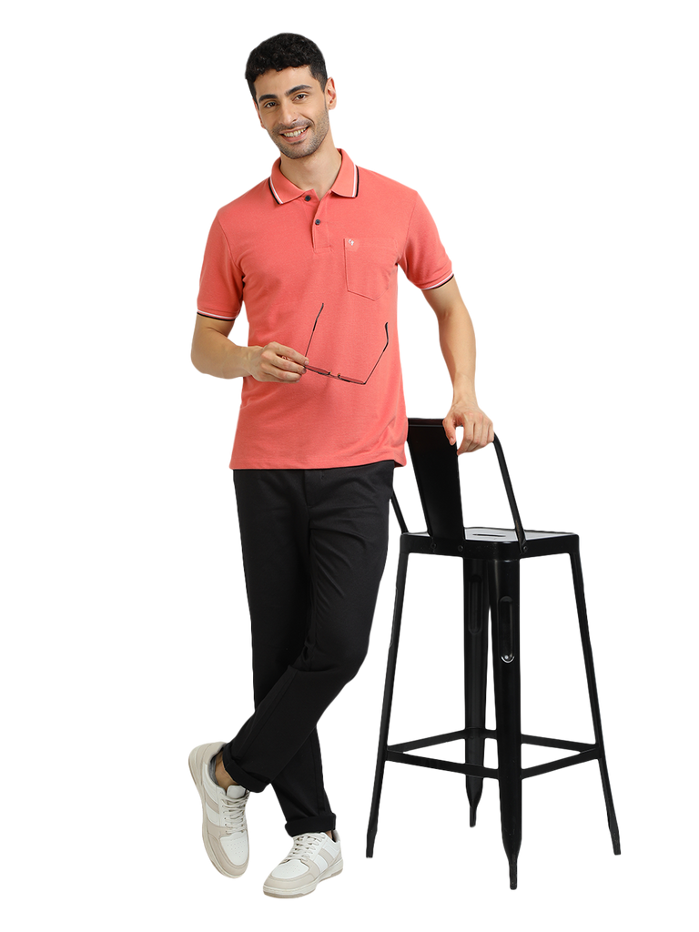 Model wearing Clarke Gable's Peach Solid Polo Collar T-Shirt in a casual setting