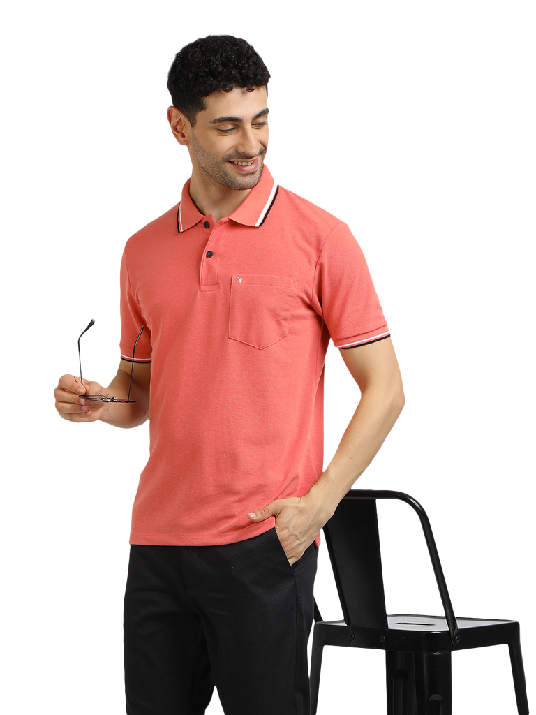 Model wearing Clarke Gable's Peach Solid Polo Collar T-Shirt in a casual setting