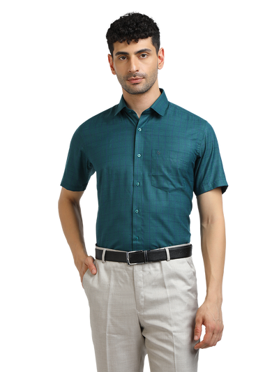 Model wearing Clarke Gable's Peacock Blue Checked Formal Shirt in a casual setting