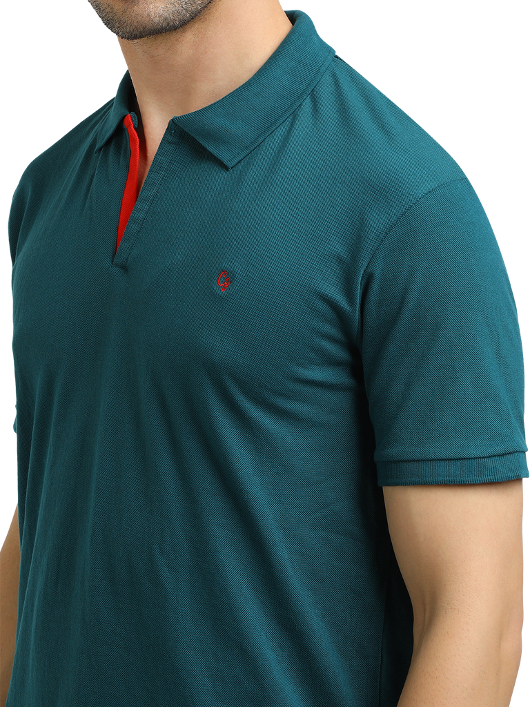 Model wearing Clarke Gable's Peacock Solid Polo Collar T-Shirt in a casual setting